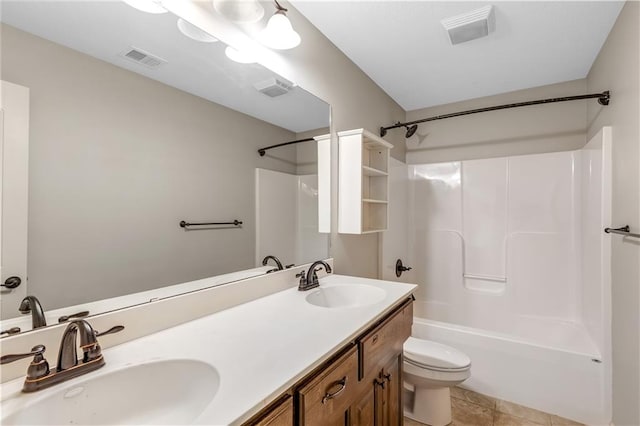 full bathroom featuring toilet, shower / tub combination, vanity, and tile patterned flooring