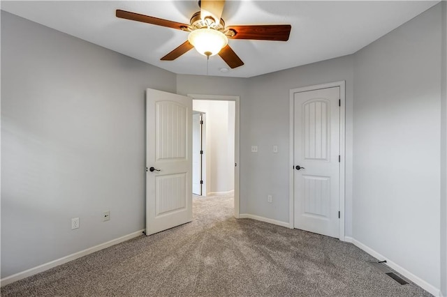 unfurnished bedroom with light carpet and ceiling fan