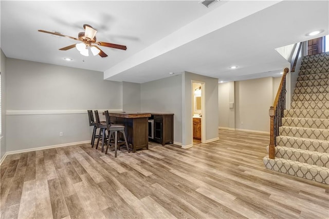 dining room with light hardwood / wood-style floors and ceiling fan