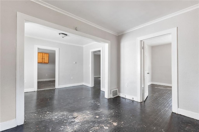 unfurnished room with crown molding and dark hardwood / wood-style flooring