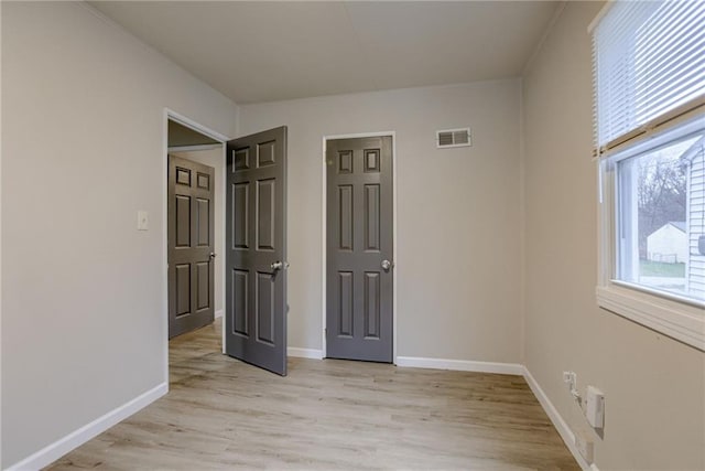 unfurnished bedroom featuring light hardwood / wood-style floors