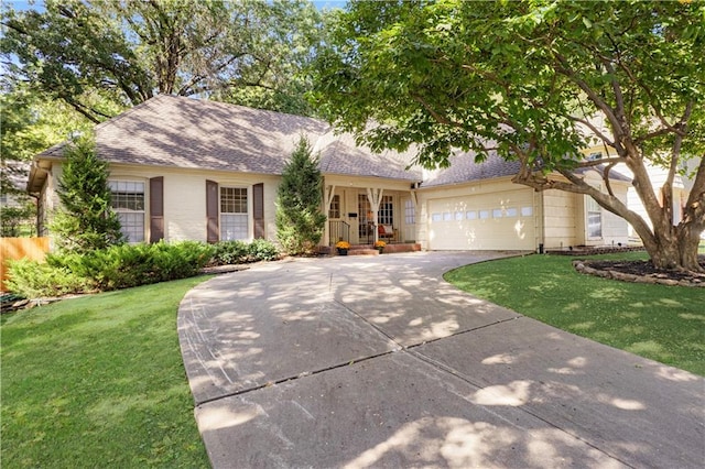 view of front of house with a front yard and a garage