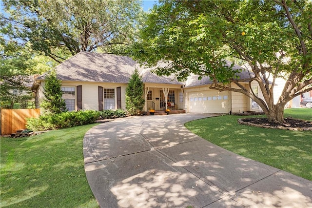 view of front of house with a front yard and a garage