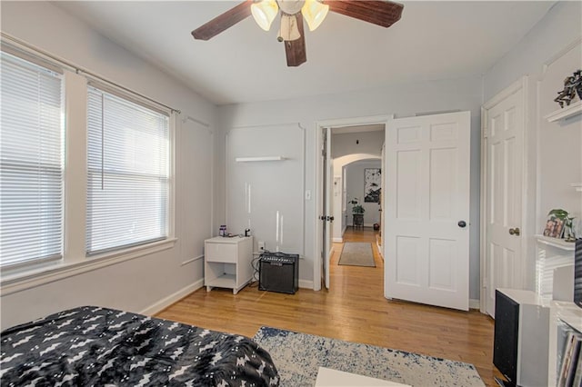 bedroom with light hardwood / wood-style flooring and ceiling fan