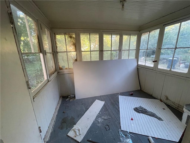 unfurnished sunroom featuring a wealth of natural light