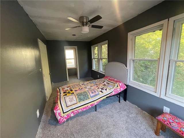 bedroom with ceiling fan and carpet