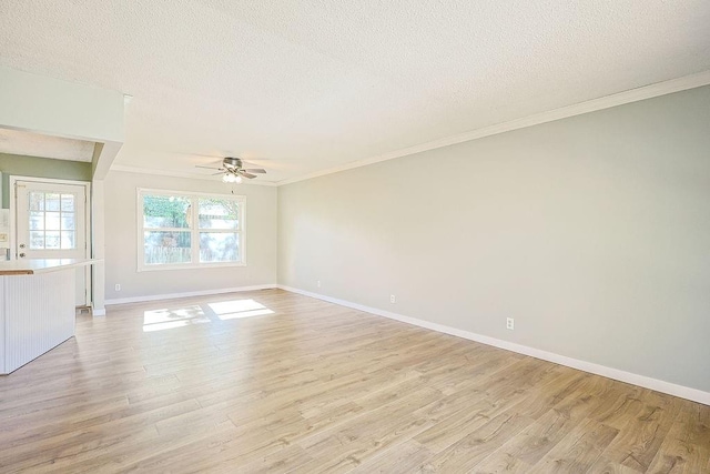 empty room featuring light wood-type flooring, a textured ceiling, and ceiling fan