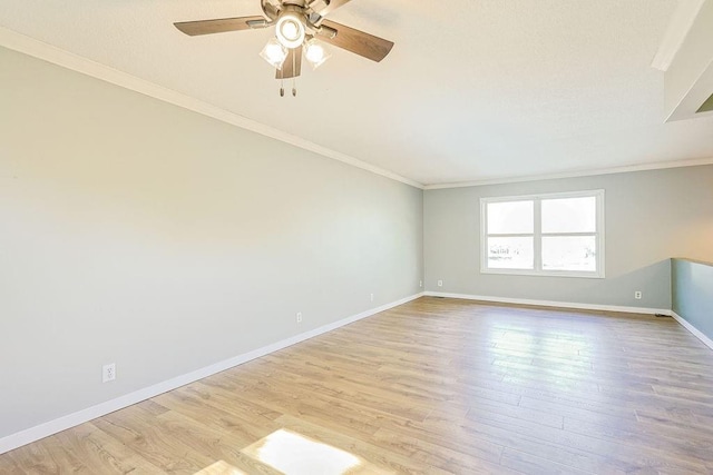 unfurnished room featuring ceiling fan, light hardwood / wood-style flooring, and ornamental molding