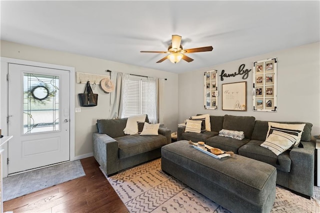 living room with hardwood / wood-style flooring and ceiling fan