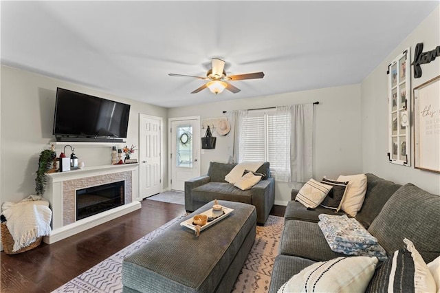 living room with dark hardwood / wood-style floors and ceiling fan