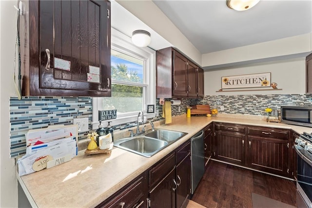 kitchen with decorative backsplash, dark hardwood / wood-style flooring, dark brown cabinetry, stainless steel appliances, and sink