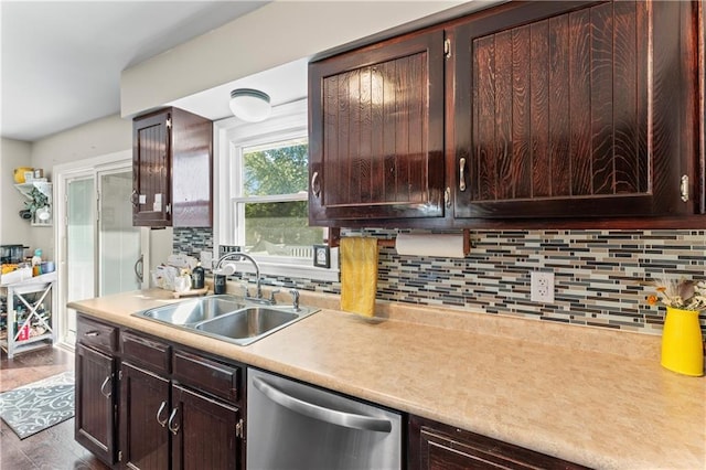 kitchen featuring backsplash, dark hardwood / wood-style floors, stainless steel dishwasher, and sink