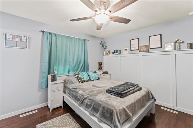 bedroom featuring ceiling fan and dark wood-type flooring