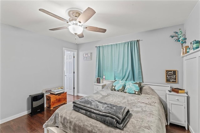 bedroom with ceiling fan and dark hardwood / wood-style floors