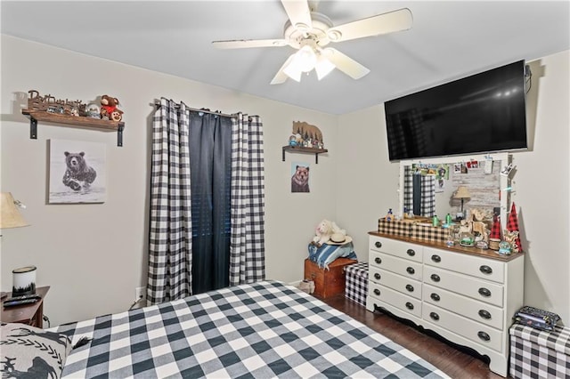 bedroom featuring ceiling fan and dark hardwood / wood-style floors