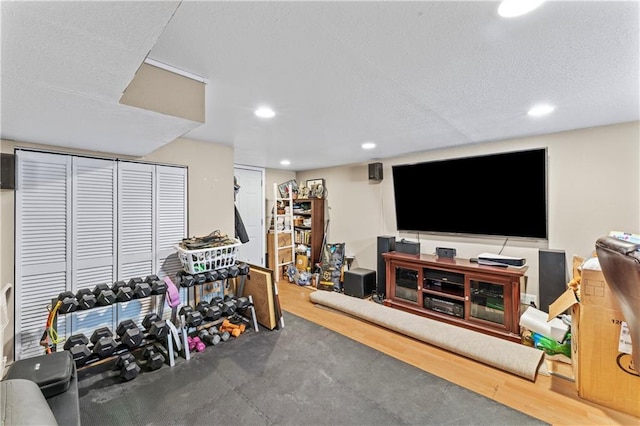 workout room featuring a textured ceiling