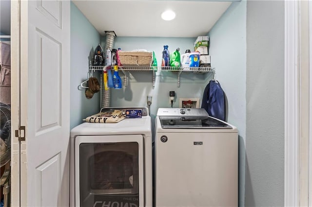 washroom with washing machine and clothes dryer