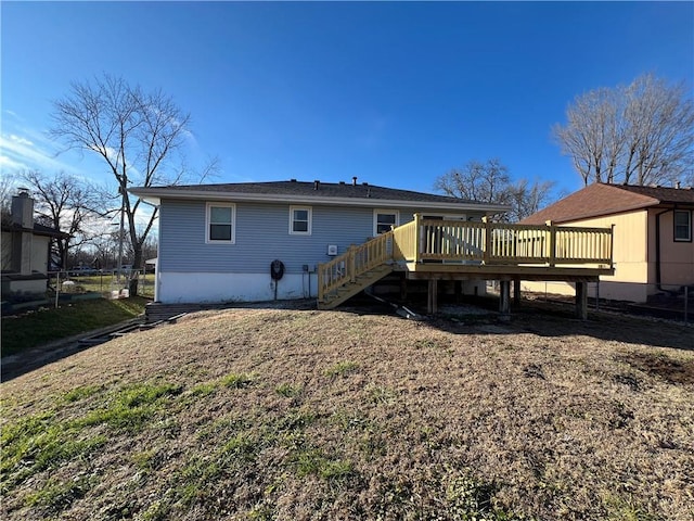 back of property with a wooden deck