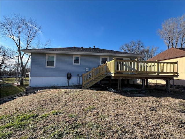 back of house featuring a wooden deck