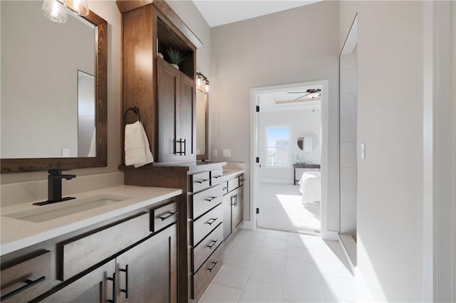 bathroom with ceiling fan, vanity, and tile patterned flooring