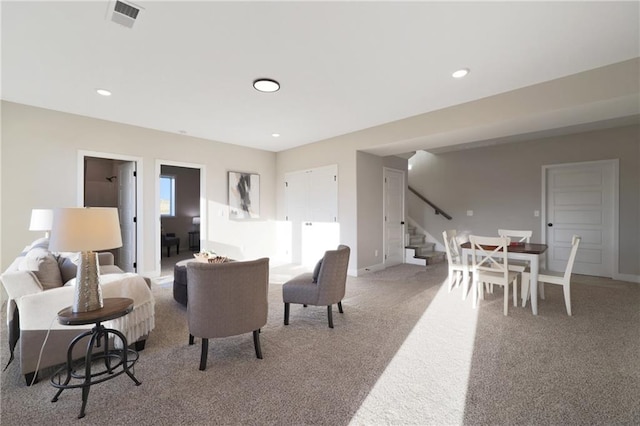 living room featuring light colored carpet