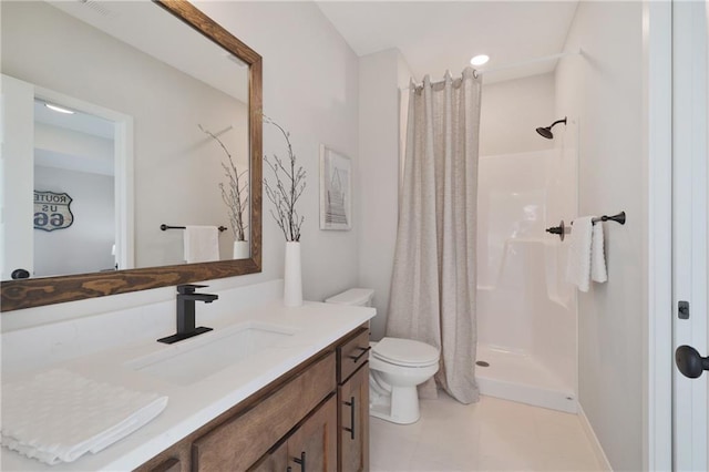 bathroom with curtained shower, vanity, and toilet