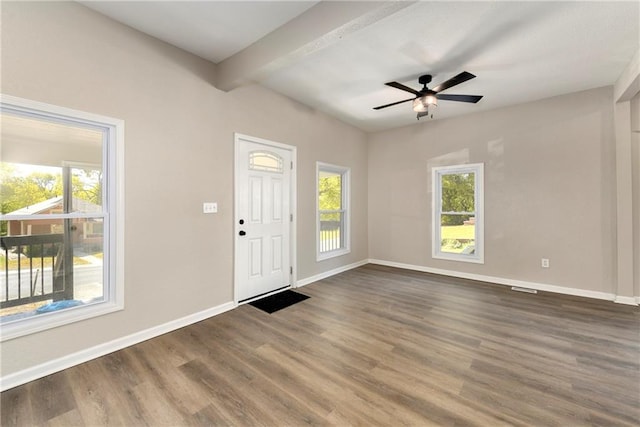 entrance foyer with ceiling fan, beam ceiling, and dark hardwood / wood-style floors