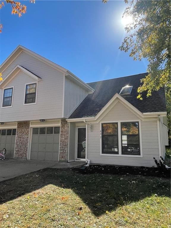 view of front of property with a garage and a front yard