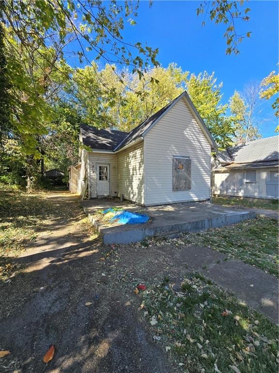 view of property exterior featuring a patio area