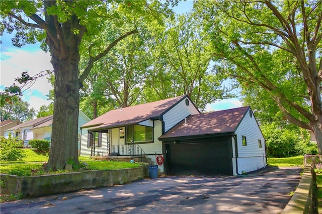 view of front of property with a garage and a porch