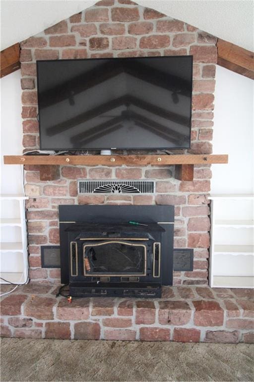 room details with a wood stove and carpet