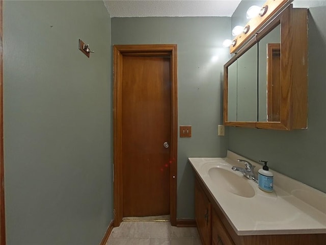 bathroom featuring tile patterned floors and vanity