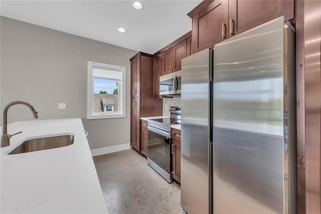 kitchen with sink and appliances with stainless steel finishes