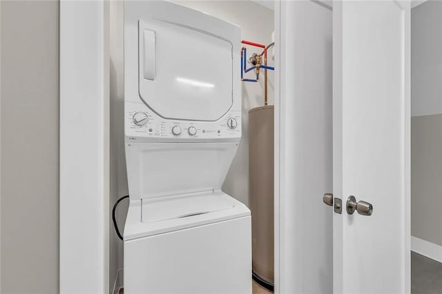 washroom featuring stacked washer and dryer