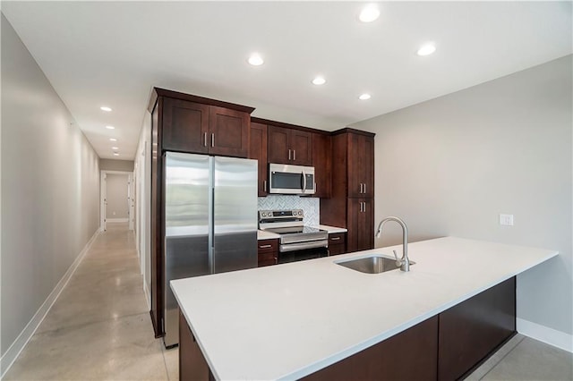 kitchen with decorative backsplash, sink, dark brown cabinets, and stainless steel appliances