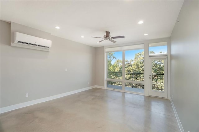 spare room with a wall mounted air conditioner and ceiling fan