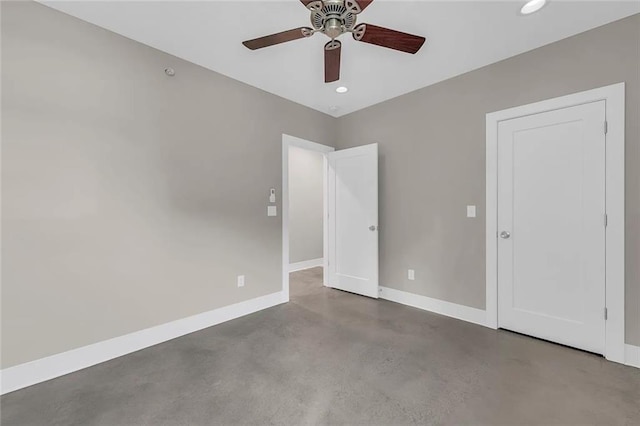 interior space featuring concrete floors and ceiling fan