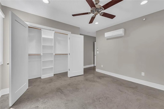 unfurnished bedroom featuring an AC wall unit and ceiling fan