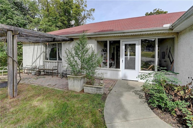 back of house with a yard and a patio area