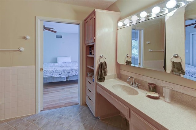 bathroom featuring vanity, ceiling fan, and hardwood / wood-style flooring