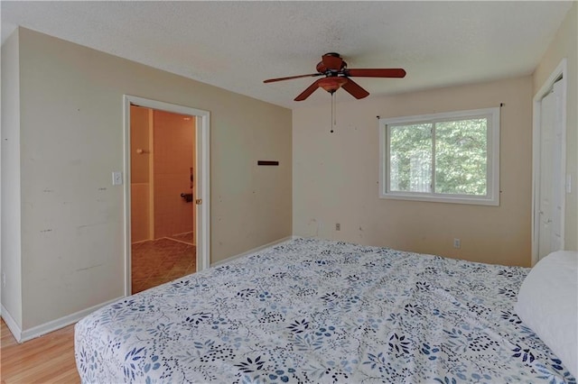 bedroom featuring hardwood / wood-style flooring and ceiling fan