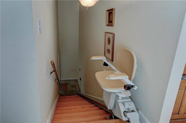 bathroom with hardwood / wood-style floors