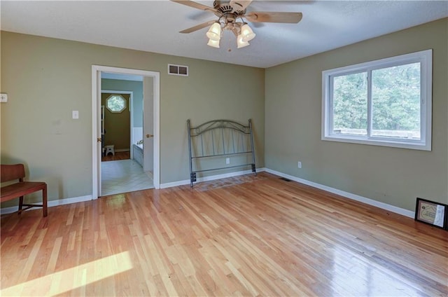 bedroom featuring light hardwood / wood-style floors and ceiling fan