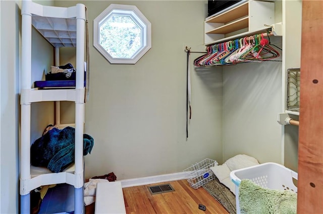 laundry room featuring hardwood / wood-style floors