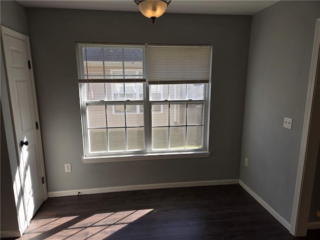 empty room featuring dark hardwood / wood-style flooring