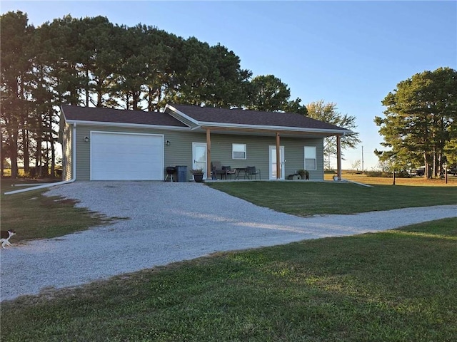 ranch-style home with a front yard and a garage