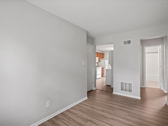 spare room featuring light wood-type flooring