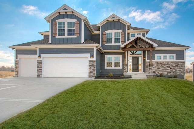 craftsman-style house with a front lawn and a garage