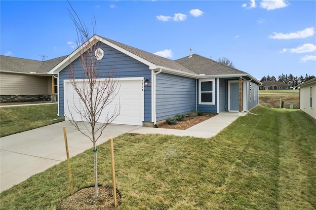 ranch-style house featuring a garage and a front yard