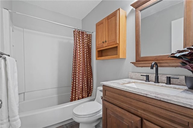 full bathroom featuring vanity, hardwood / wood-style floors, shower / bath combo with shower curtain, and toilet